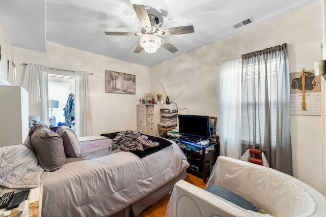 bedroom featuring ceiling fan and hardwood / wood-style flooring