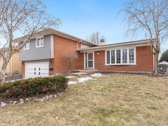 tri-level home featuring a front yard and a garage