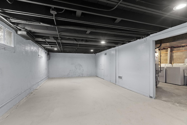 basement featuring washing machine and dryer