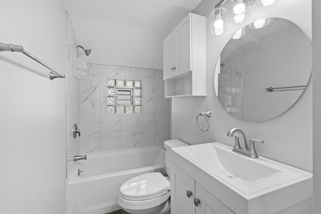 full bathroom with toilet, tiled shower / bath combo, and vanity