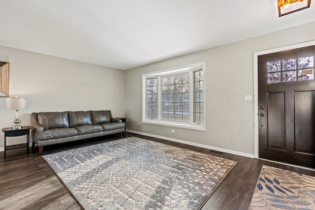 living room with dark hardwood / wood-style flooring