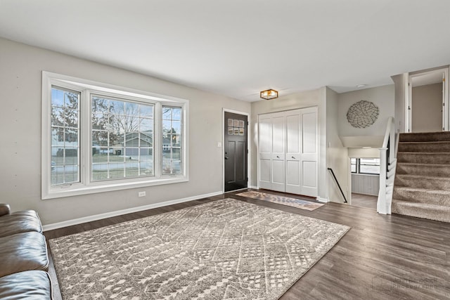 entrance foyer with dark hardwood / wood-style flooring