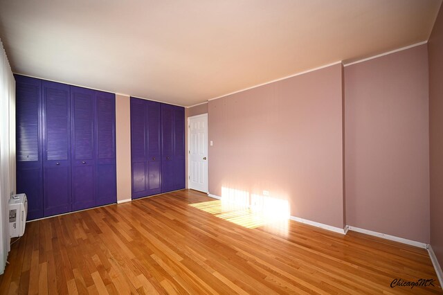 unfurnished bedroom featuring hardwood / wood-style floors