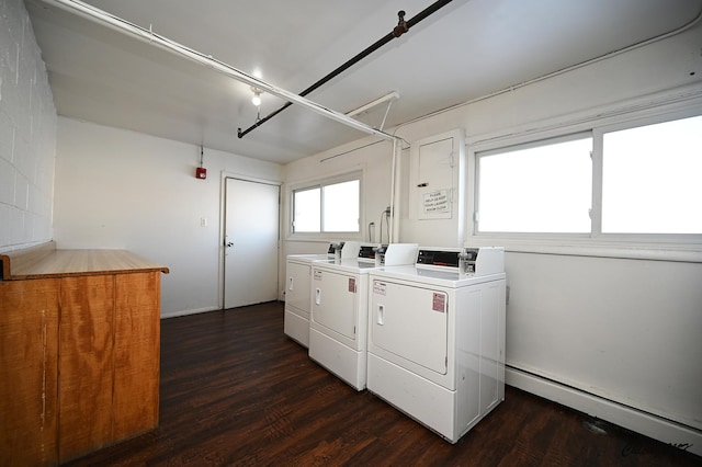 laundry area with separate washer and dryer, dark wood-type flooring, and a baseboard heating unit