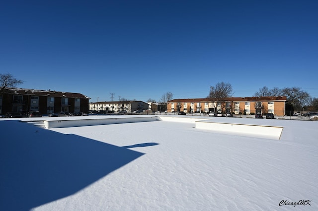 view of yard layered in snow