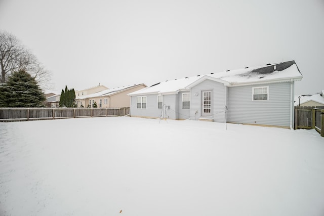 view of snow covered house