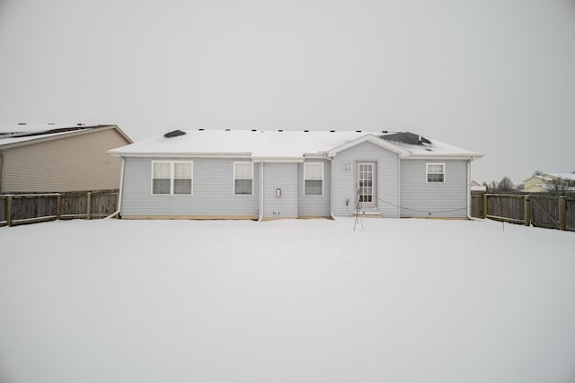 view of snow covered house