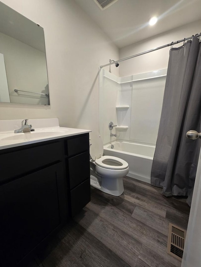 full bathroom featuring shower / bath combination with curtain, toilet, vanity, and wood-type flooring