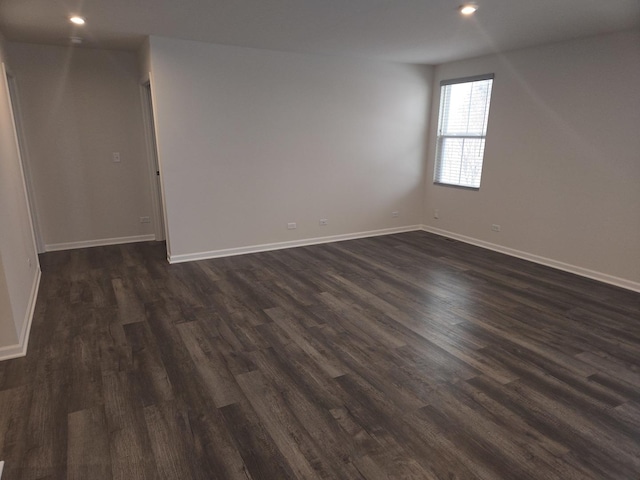 spare room featuring dark hardwood / wood-style floors