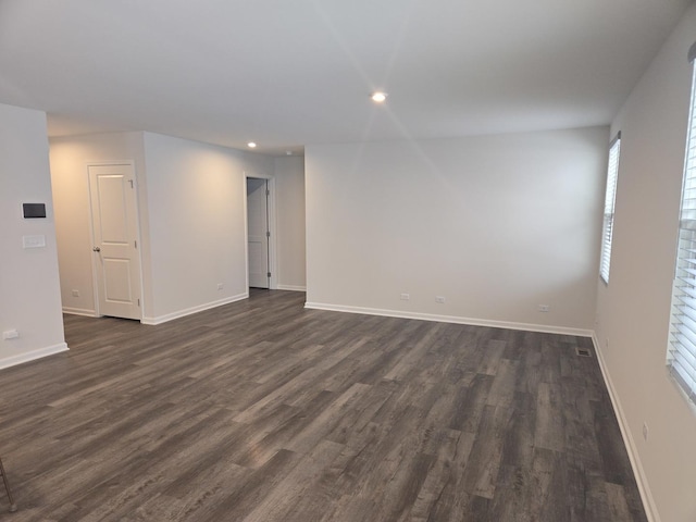 empty room featuring dark hardwood / wood-style floors