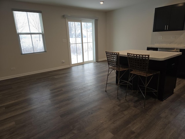 dining space with dark wood-type flooring