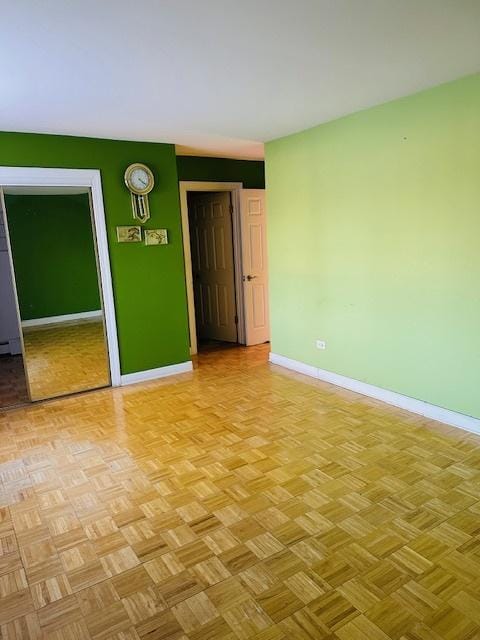 unfurnished room with light parquet floors