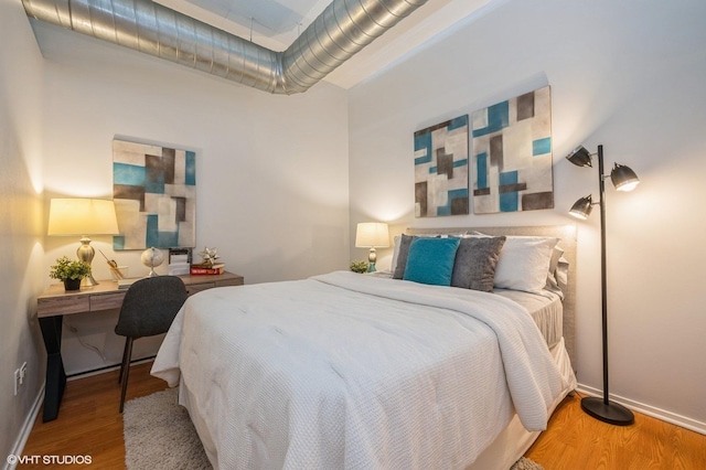 bedroom featuring hardwood / wood-style floors