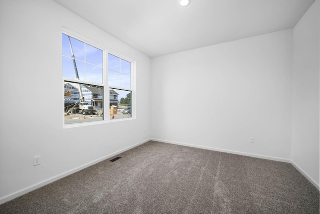 unfurnished room featuring carpet flooring