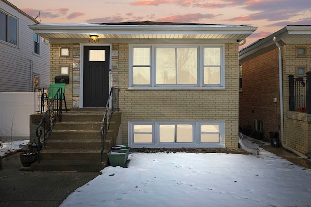 view of snow covered property entrance