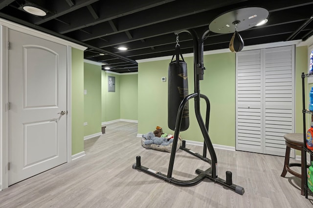 workout area featuring light wood-type flooring