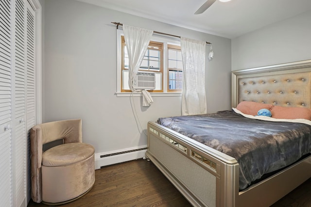 bedroom featuring ceiling fan, cooling unit, dark wood-type flooring, a closet, and a baseboard radiator