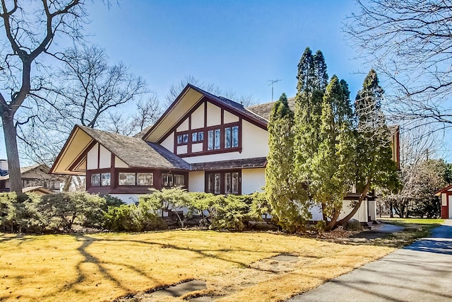 view of property exterior featuring a yard