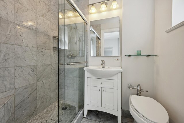 bathroom featuring toilet, walk in shower, and vanity