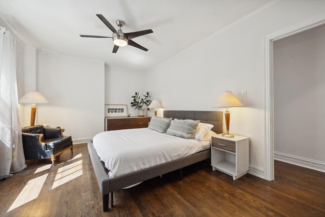 bedroom featuring ceiling fan, ornamental molding, and dark wood-type flooring