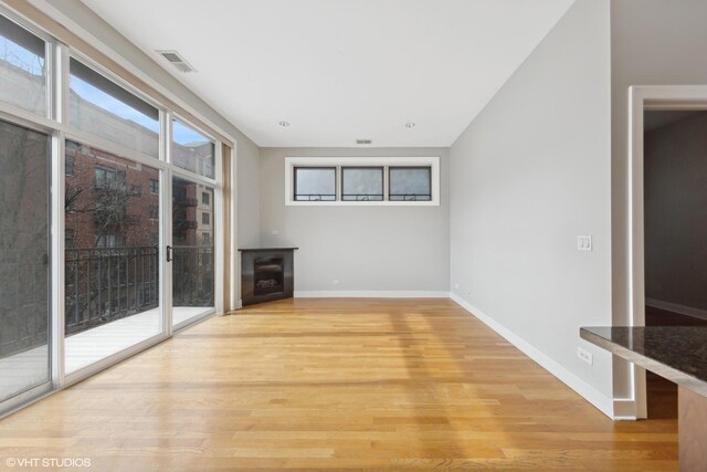 living room featuring sink and light wood-type flooring