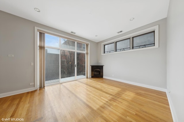 unfurnished living room featuring hardwood / wood-style floors