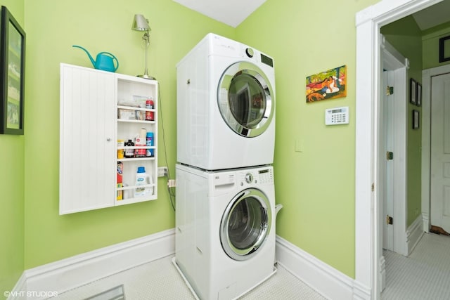 laundry area with stacked washer / dryer