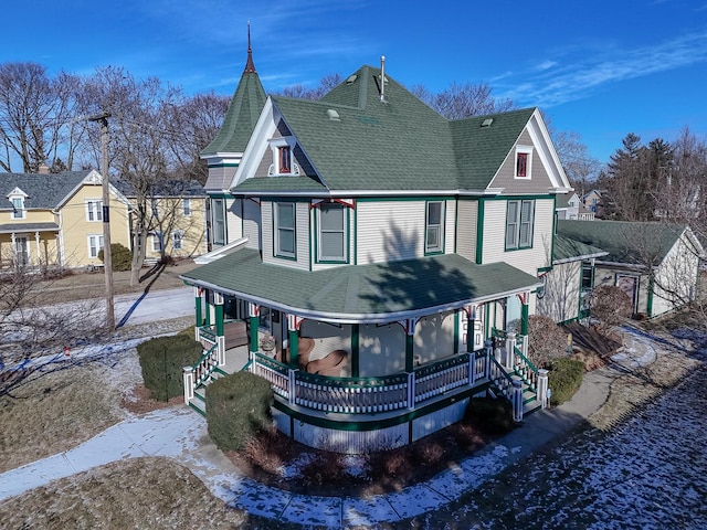 rear view of property featuring a porch