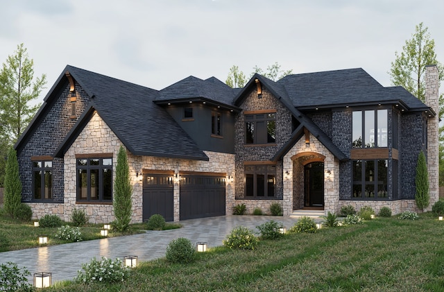 view of front of house featuring a garage and a front yard