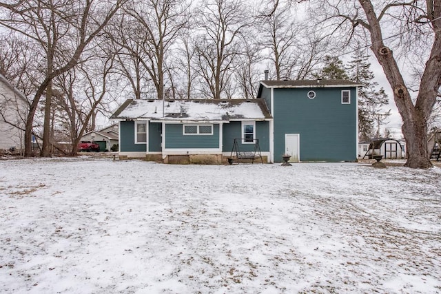 view of snow covered house