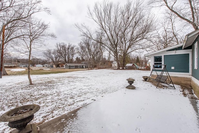 view of yard layered in snow