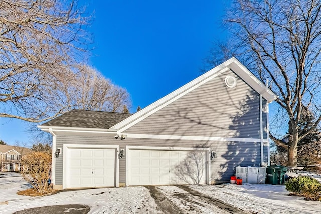 view of side of property with a garage