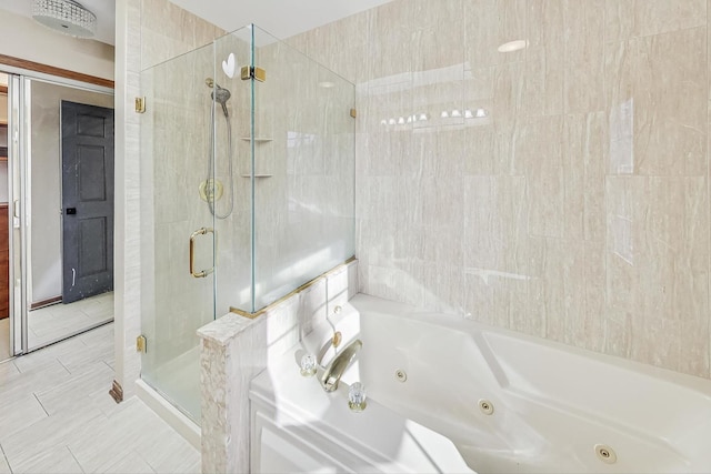 bathroom featuring tile patterned flooring and independent shower and bath