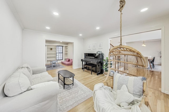 living room featuring ornamental molding and hardwood / wood-style flooring