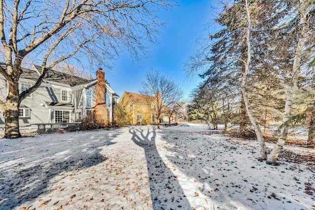 view of yard layered in snow