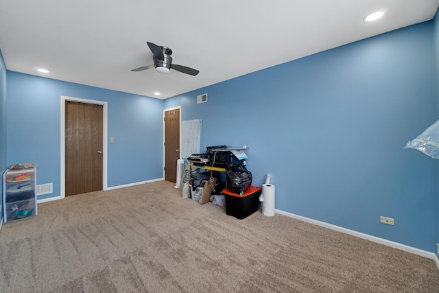 misc room with ceiling fan and carpet floors