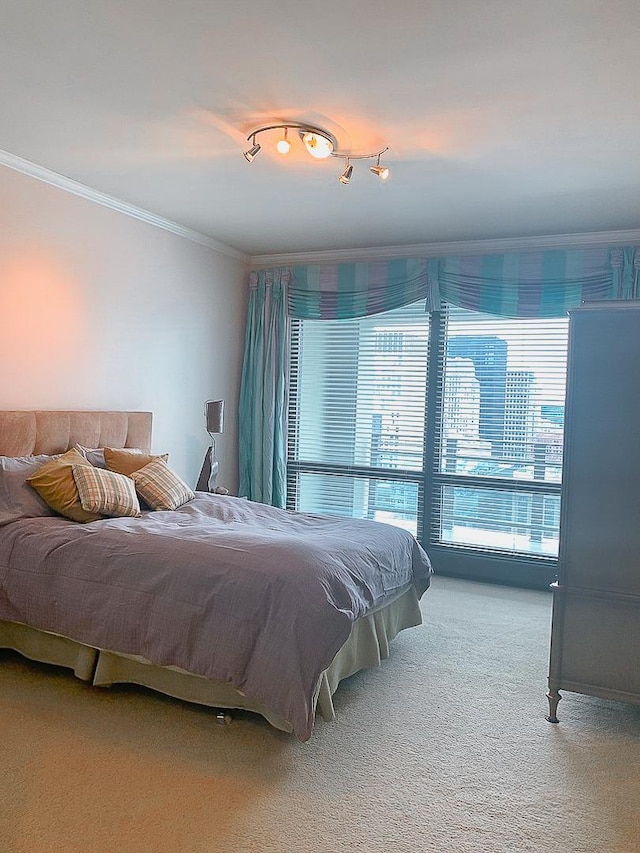 carpeted bedroom featuring ornamental molding