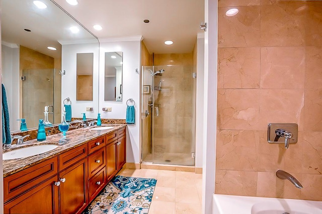 bathroom with vanity, tile patterned flooring, crown molding, and separate shower and tub