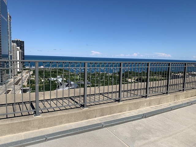 balcony featuring a water view