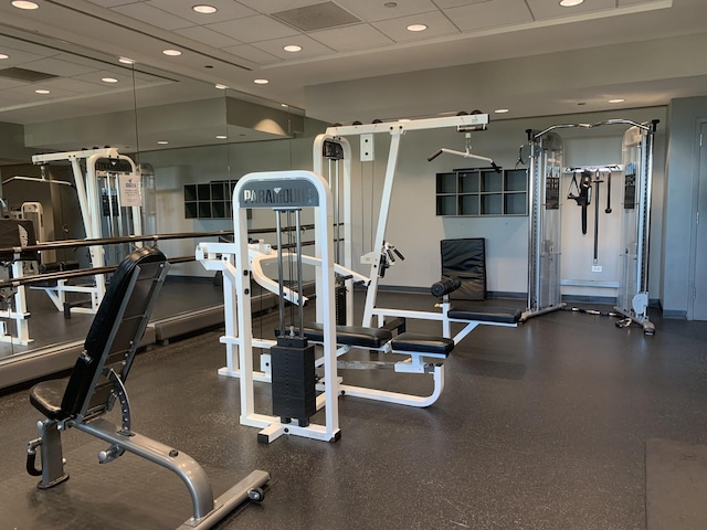 exercise room with a drop ceiling