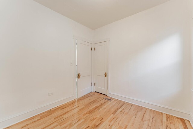 spare room featuring light hardwood / wood-style flooring