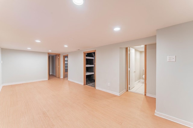 basement featuring light hardwood / wood-style flooring