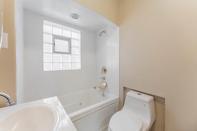 full bathroom with sink, shower / bathing tub combination, and toilet