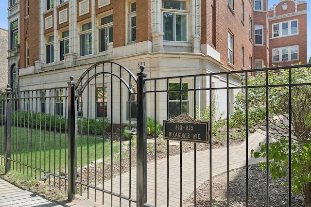 view of gate featuring a yard