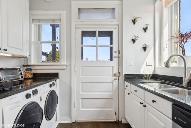 laundry area featuring separate washer and dryer, dark hardwood / wood-style floors, and sink