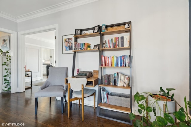 sitting room featuring ornamental molding and dark wood-type flooring