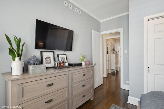 interior space with ornamental molding and dark hardwood / wood-style floors