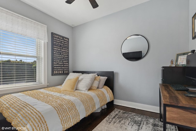 bedroom featuring ceiling fan and dark hardwood / wood-style flooring