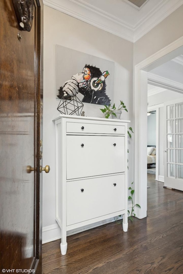 interior details with hardwood / wood-style flooring and crown molding