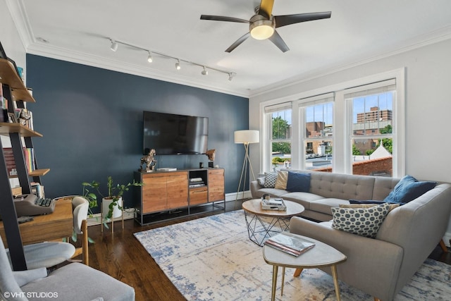 living room featuring ceiling fan, ornamental molding, and dark hardwood / wood-style floors